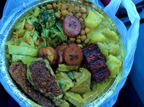 large plate:  3 proteins of jerk tofu, curry tofu, drumsticks; and 4 sides of curry garbanzos, curry potatoes, curry veg, and curry cabbage at Ninth Square Market Caribbean Style in New Haven
