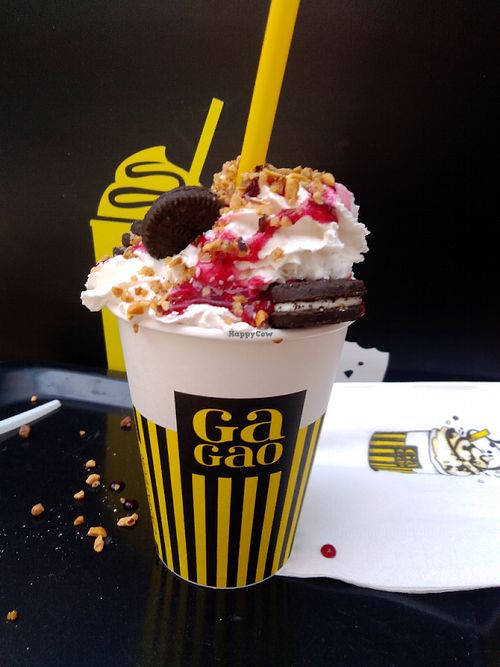 Vegan Hot Chocolate with soy whipped cream, mini oreo cookies, peanuts, raspberry topping...sweet treat!! at Gagao Cacaoteria in Serris