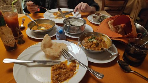 Chola Bhatura with naan bread on the right. Lentils curry and rice on the left at Buena Vista Curry Club in Havana