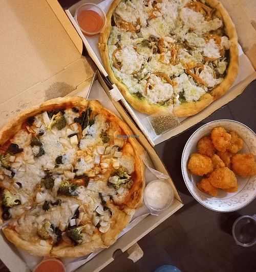 Pizzas and cauli wings (delivery) at Rad Rabbit in Chiang Mai