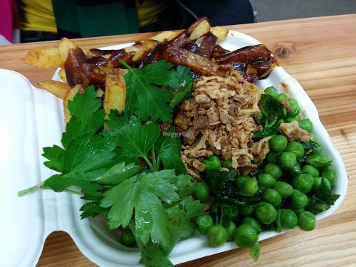 steak-and-cheese pie topped with crispy onions, with chips and peas at Young Vegans - Online only in East London