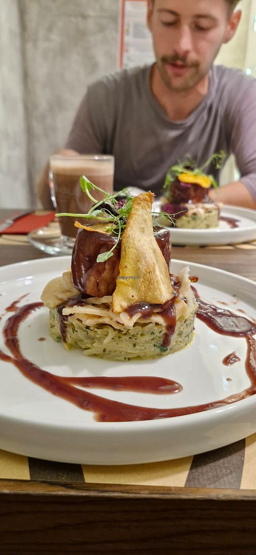 Chef's seasonal special. A traditional Slovenian dish with fermented turnip, unleavened bread, gravy, vegetable chips, and juicy marbles stake. at Bistro Maha in Ljubljana