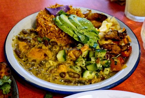 Hot plate with jollof rice and curries at Jah Jah in Paris
