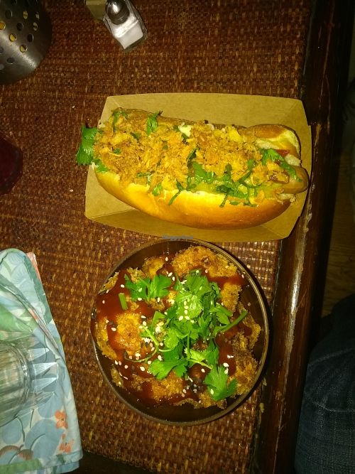 Vegan "hot dog" and cauliflower wings with their homemade sauce at Jah Jah in Paris