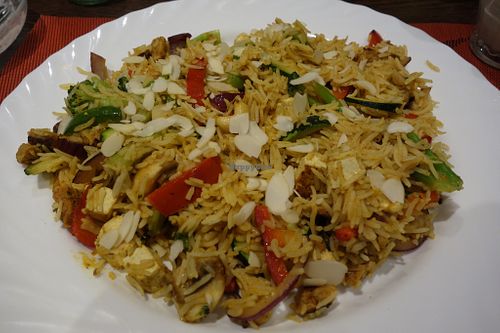 Bombay birijani (rice with vegetables, soy chicken, tofu, almonds, and cashews) (vegan) at Veggie House in Saarbrucken