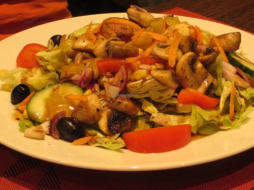 No. 192 Veggie House Iceberg Lettuce Salad (with cucumber, tomatoes, fried mushrooms, red pepper, olives, chillis, and red onions) (vegan) at Veggie House in Saarbrucken