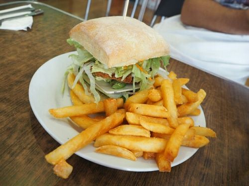 delicious vegan burger with cheese and fries  at Zenhouse Vegetarian Yum Cha  in Adelaide
