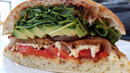 Steak Sandwich, sub Field Roast Sausage, and Daiya Cheese. Avocado, Roasted Peppers, Tomatillo Sauce, House made bread at Pitfire Pizza in West Los Angeles