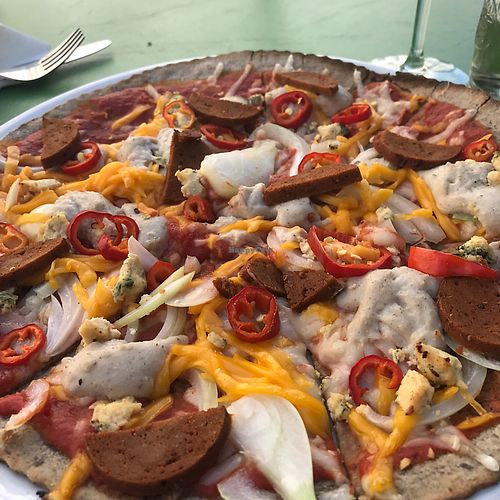 4 cheeses pizza with additional toppings  at Leonardo Verde in Warsaw