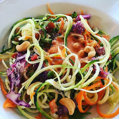Raw vegan noodles with a mild chilli and coconut sauce and cashew nuts  at Gaia Vegan Vegetarian Restaurant Albir in Albir