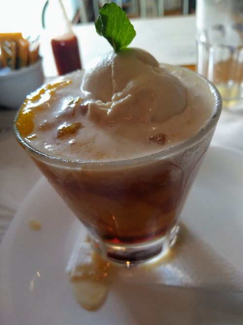 Dessert of the day, with mango sorbet, mango pieces, some sort of alcohol shot, and ice cream. at Camaraderia Gastrobar in Belo Horizonte