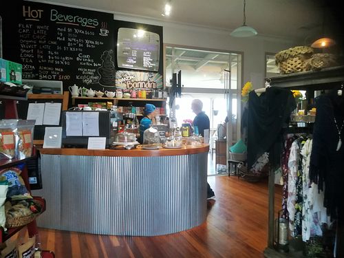 at the counter with the cafe behind it at Whole Life Organics in Maungaturoto