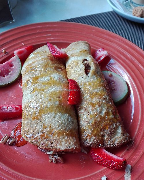 Pancakes with a banana, nut filling and strawberries. at The Secret Garden in Benoni