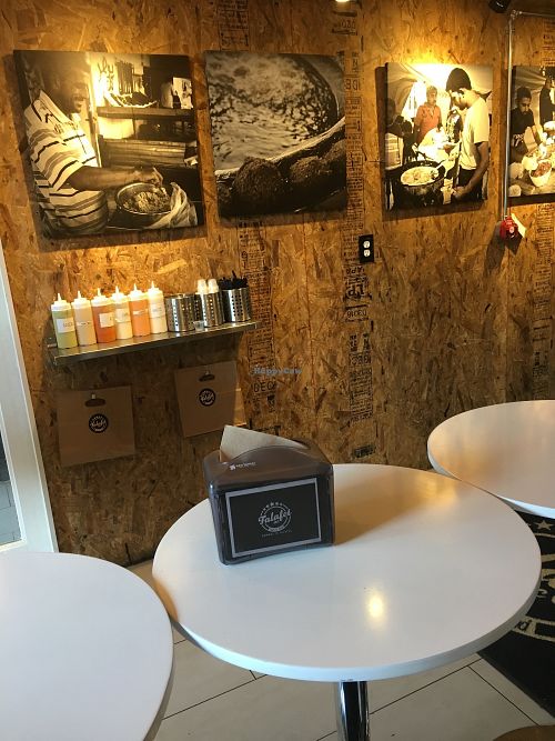 Sauce line up, to go sauce containers, forks and to go bags at Falafel Inc - Georgetown in Washington