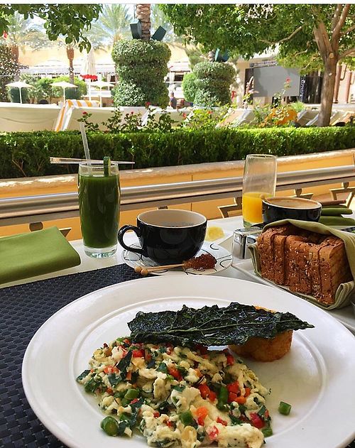 shaded outdoor dining available overlooking the pool  at Wynn Hotel - Jardin in Las Vegas
