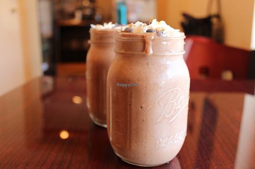 Malted Choco Maca Milkshake: Coconut, banana, cacao, chia seeds,  sea moss, dates, maca, tribulus Topped w/ Signature Sky High Whip at Pure Joy Kitchen in Bend