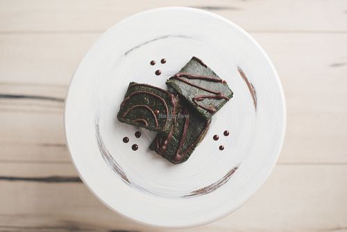 Activated walnuts, coconut + cacao + goji berries, hemp seeds, chia seeds, maca, green powder, dates, vanilla, spices
Dipped in raw chocolate sauce at Pure Joy Kitchen in Bend