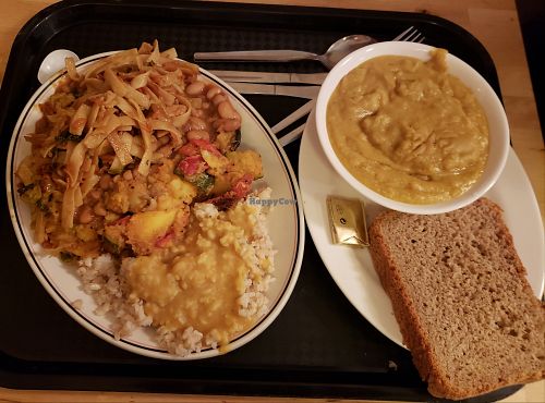 Medium dinner plate (a sampler of the different dishes they had that day, including curry on rice, curried vegetables, baked beans and more) and soup. Everything pictured here is vegan, other than the butter.  at Govinda's - North City in Dublin