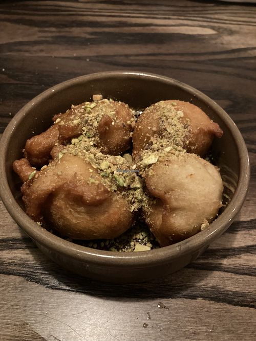 Greek husband happy with Greek desert!   at The Tipsy Vegan in Cambridge