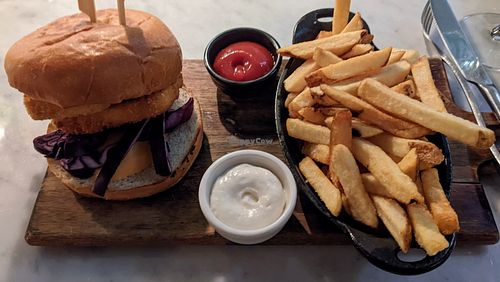 Poorly assembled tofu burger with massive chunks of raw red cabbage and undercooked cold fries at LOV - Montagne in Montreal