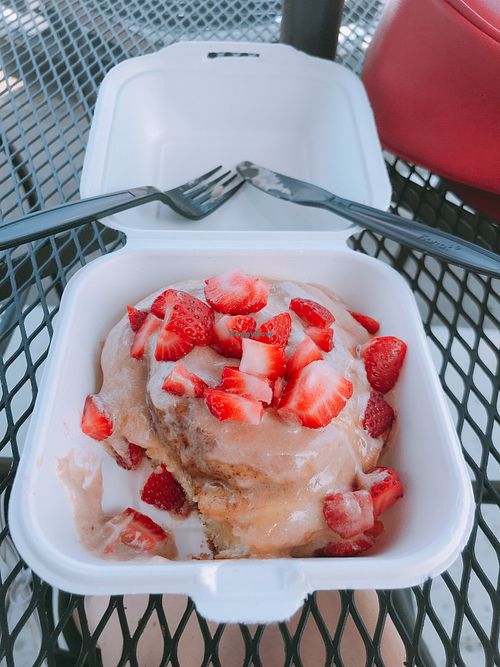 bun with chocolate sauce & strawberries  at Cinnaholic in Los Angeles
