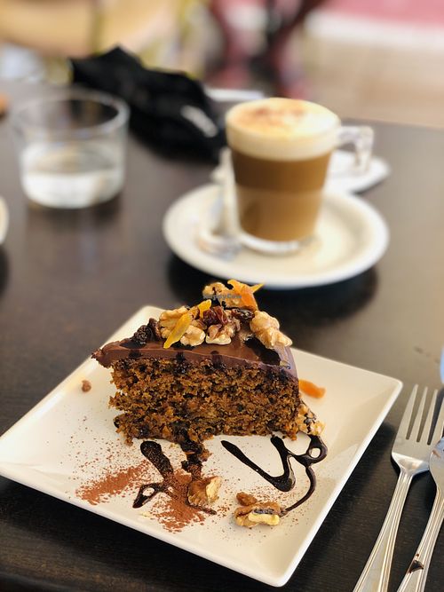 Carrot cake (tarta de zanahoria) and a cappuccino  at Petit Vegan in Cambrils