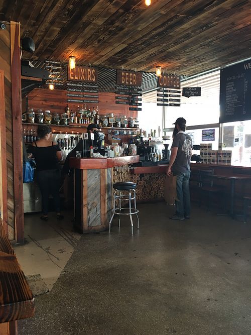 Order at the bar, they bring food to your table at The Buzz Mill in San Marcos