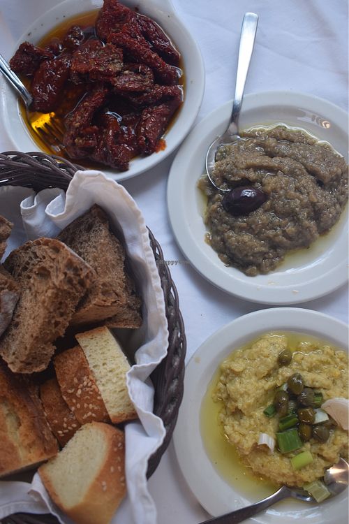 Sundried tomatoes, aubergine purée, garlic purée, bread (all vegan) at Candouni in Santorini