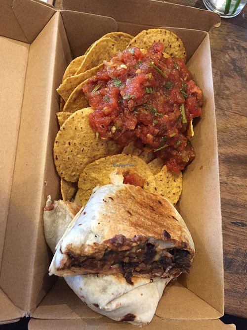 Vegan burrito with corn chips and salsa at The Merri in Preston