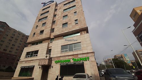 Located on the opposite side of the road behind or to the north of Emart (Chinggis branch) at Organic Market in Ulaanbaatar