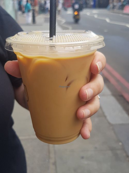 Iced oat decaf latte with caramel syrup 😋 at Over Under Coffee in South West London