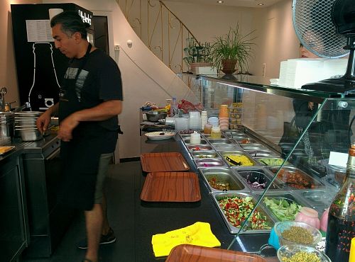 making our amazing falafel wrap at Za Zaa Barfi - Gerbergasse in Basel