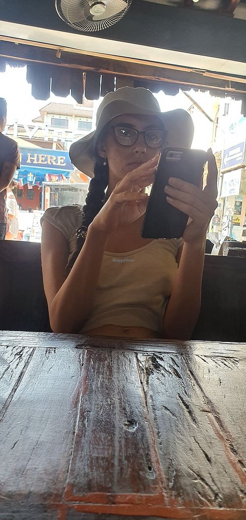 She waits for oil free sugar rich vegan food at Dow Vegan Restaurant in Koh Phi Phi