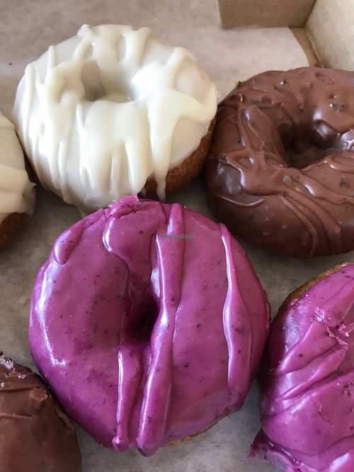 orange creamsicle, chocolate earl grey and blueberry donuts! at Frickin' Delights Donuts in Devon