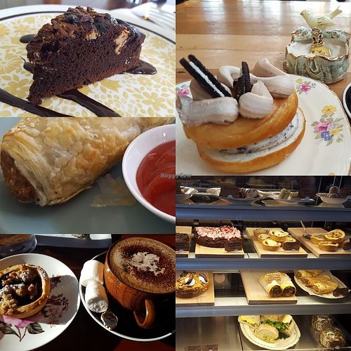 Peanut butter brownie, oreo doughnut, sausage roll, cabinet, berry tart, coconut mocha with marshmallows, and the cabinet. at Portershed in Christchurch