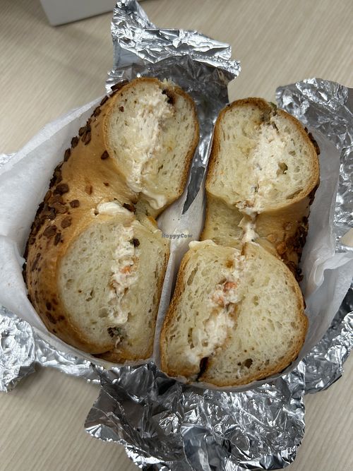 Toasted onion bagel with veggie vegan cream cheese  at Bare Naked Bakery & Cafe in Plainview