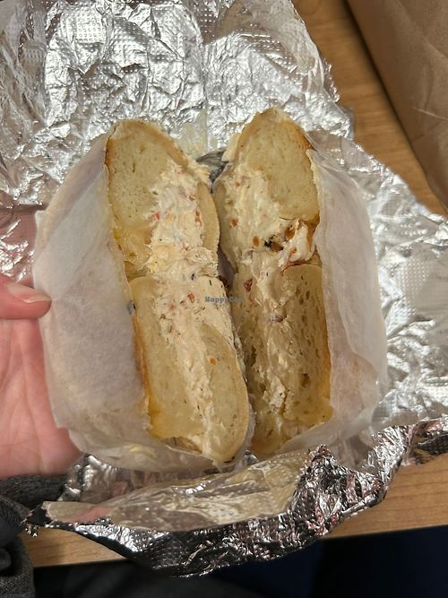 Onion bagel with vegan veggie cc  at Bare Naked Bakery in Bellmore
