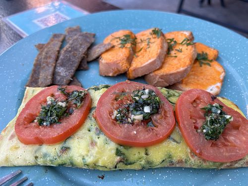 Omelette with spinach and milanesa   at Por Siempre Vegana Vol II in Mexico City