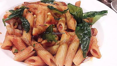 Penne pasta with roast plum tomato sauce, pine nuts & fried basil at Breda Murphy Restaurant in Whalley
