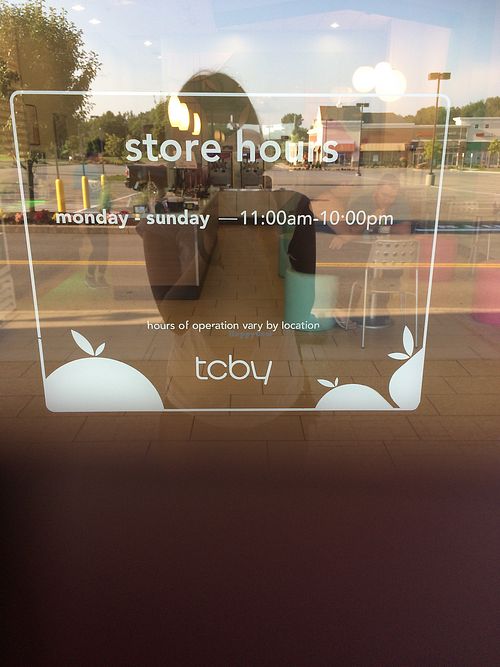store hours on window at TCBY in Victor