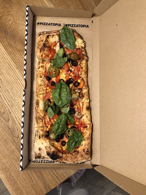 V cheese, mushrooms, corn,tomatoes, olives, jalapenos, pepper and spinach pizza at Pizzatopia in Krakow