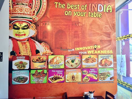 Mural on the wall with lots of food pics  at Go Chaatzz in Fremont