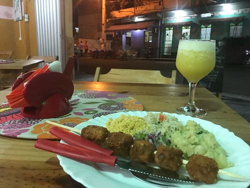 Tofu kebab, farofa, rice, potato, and suco at Naturalize Bistro Vegetariano in Manaus