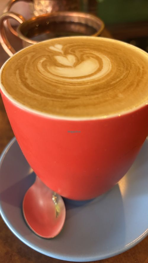 Large soy flat whitee  at Buddha Bowl Cafe in Newtown