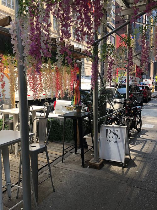 restaurant entrance and outdoor seating at P.S. Kitchen in New York City