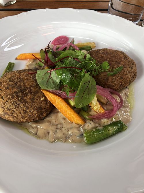 Vegan burger plate with creamy mushroom sauce at Ulla Winbladh in Stockholm