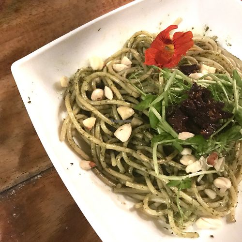 Pesto gluten free pasta with sun dried tomatoes and almond cheese at Hari OM Food and Wellness in Uvita