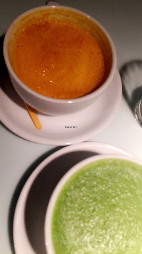 Tumeric latte (orange) and matcha latte at Sticks N Sushi in Rungsted