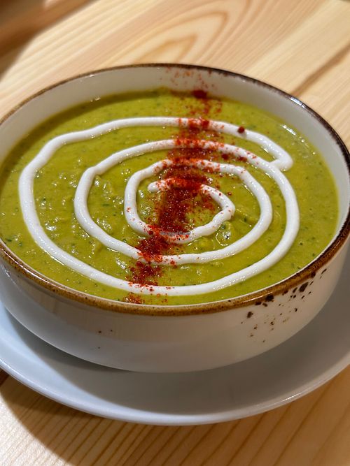 Vegan green curry soup with chickpeas and tahini sauce at Goroh in Omsk