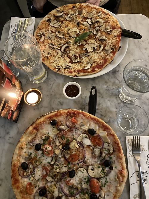The bottom pizza is the Vegan Giardana (idk how to spell it) approx £17/18 and the top one is a vegetarian margarita with mushrooms added approx £16  at Pizza Express - Corn Exchange in Manchester